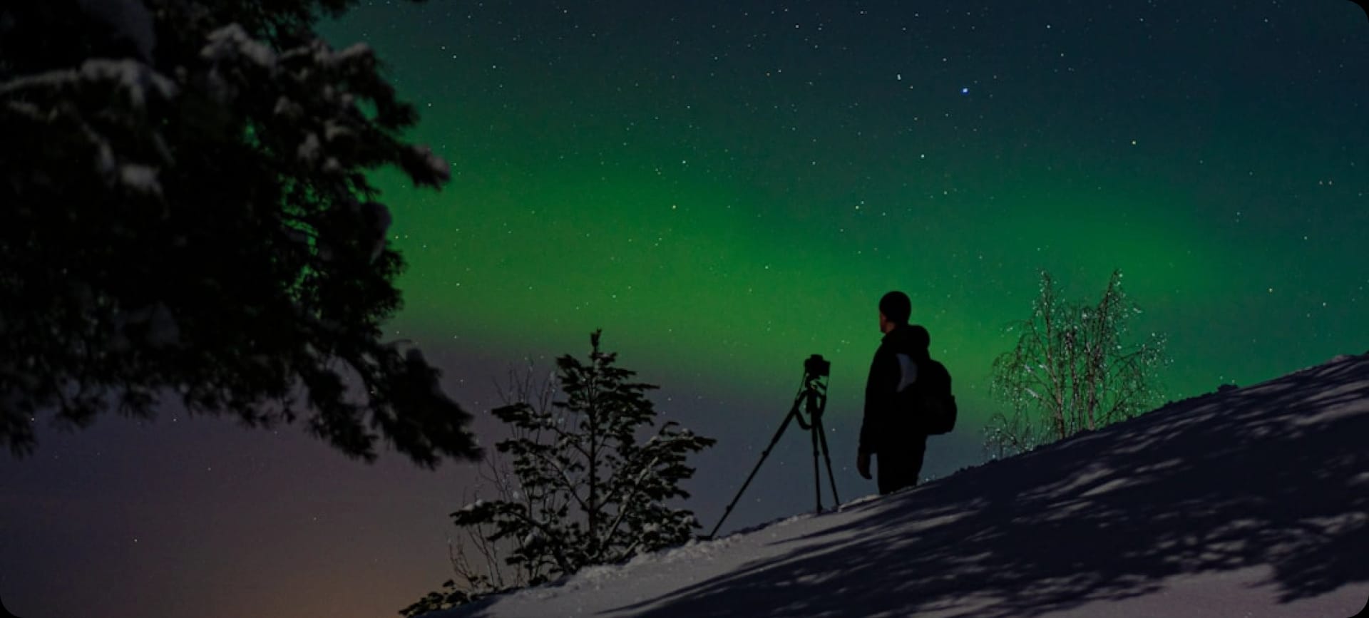 Person photographing Northern Lights